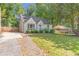 Beautiful home with a manicured lawn and long driveway at 2048 Mcafee Rd, Decatur, GA 30032