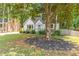 Inviting home with landscaped yard and mature trees at 2048 Mcafee Rd, Decatur, GA 30032