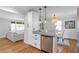 Open concept kitchen with granite counters, stainless appliances, connects to dining and living area at 2048 Mcafee Rd, Decatur, GA 30032