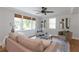 Cozy living room with ample seating, ceiling fan, and natural light at 2048 Mcafee Rd, Decatur, GA 30032