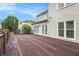 Expansive wooden deck off the back of the house with access to the fenced backyard and patio at 2330 Springmonte Pl, Cumming, GA 30041
