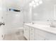 Bright bathroom offers tile floors, double sink vanity and shower-tub combo at 2330 Springmonte Pl, Cumming, GA 30041
