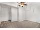 Spacious carpeted bedroom with large column features neutral walls and ceiling fan at 2330 Springmonte Pl, Cumming, GA 30041