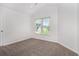Comfortable bedroom featuring a vaulted ceiling and bright window at 2330 Springmonte Pl, Cumming, GA 30041