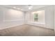 Spacious, carpeted bonus room with window seat features recessed lighting and neutral walls at 2330 Springmonte Pl, Cumming, GA 30041