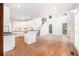 Spacious kitchen with white cabinetry, stainless appliances, and hardwood floors at 2330 Springmonte Pl, Cumming, GA 30041