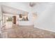Open-concept living space with sightlines to the kitchen and a staircase at 2330 Springmonte Pl, Cumming, GA 30041