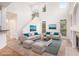Open living room boasts soaring ceilings, bright windows, and elegant decor at 2330 Springmonte Pl, Cumming, GA 30041