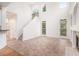 Spacious living room featuring high ceilings, bright windows, and lots of natural light at 2330 Springmonte Pl, Cumming, GA 30041