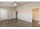 Bedroom featuring new gray flooring, neutral walls, ceiling fan and an adjoining bathroom at 3151 Kingswood Gln, Decatur, GA 30034