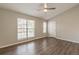 Spacious bedroom features hardwood floors, a ceiling fan, and natural light from a large window at 3151 Kingswood Gln, Decatur, GA 30034