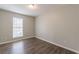 The bedroom is bright with natural light, enhanced by wood floors and neutral paint at 3151 Kingswood Gln, Decatur, GA 30034