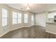 Inviting dining area with ample natural light and laminate floors, flowing seamlessly into the kitchen at 3151 Kingswood Gln, Decatur, GA 30034