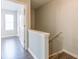 Upstairs hallway features new gray flooring, freshly painted walls and lots of natural light at 3151 Kingswood Gln, Decatur, GA 30034