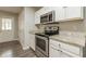 Kitchen featuring stainless steel appliances, granite countertops, and white shaker-style cabinets at 3151 Kingswood Gln, Decatur, GA 30034