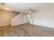 Spacious living area featuring laminate floors, a ceiling fan, and fresh paint, creating a modern aesthetic at 3151 Kingswood Gln, Decatur, GA 30034