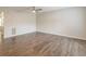 Bright, open living room with wood-look floors, a ceiling fan, and neutral paint, offering a blank canvas at 3151 Kingswood Gln, Decatur, GA 30034