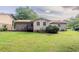 Spacious backyard with well-maintained lawn and some trees, providing a serene outdoor setting at 3420 Leisure Ln, Atlanta, GA 30349