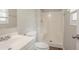 This bathroom features vinyl flooring, a single sink vanity, a toilet and shower at 3420 Leisure Ln, Atlanta, GA 30349