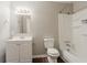 This bathroom features a white vanity and cabinets, vinyl flooring and a shower/tub combo at 3420 Leisure Ln, Atlanta, GA 30349