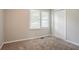 Bedroom features carpeted floors, a window, and a closet at 3420 Leisure Ln, Atlanta, GA 30349