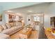 Inviting living room with comfortable beige couch and dining area in a brightly lit, open-concept home at 3420 Leisure Ln, Atlanta, GA 30349