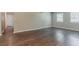 Spacious living room features wood-look floors and lots of natural light at 3420 Leisure Ln, Atlanta, GA 30349