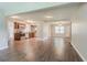 Open-concept living space with luxury vinyl plank flooring, modern lighting, and stainless steel appliances at 3420 Leisure Ln, Atlanta, GA 30349