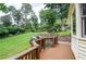 Expansive backyard with lush lawn, manicured landscaping, wooden fence and gated entrance to property at 4366 Cedar Wood Sw Dr, Lilburn, GA 30047