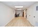 Spacious basement with wood floors, a modern ceiling, and office area at 4366 Cedar Wood Sw Dr, Lilburn, GA 30047