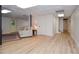 Finished basement with new wood floors and a decorative tiled ceiling at 4366 Cedar Wood Sw Dr, Lilburn, GA 30047