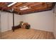 Unfinished basement area with wood flooring and exposed ceiling, ready for customization at 4366 Cedar Wood Sw Dr, Lilburn, GA 30047