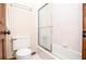 Bathroom features a neutral color palette and a glass door shower at 4366 Cedar Wood Sw Dr, Lilburn, GA 30047