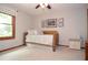 Bedroom featuring a comfortable daybed, neutral walls and trim and a view at 4366 Cedar Wood Sw Dr, Lilburn, GA 30047