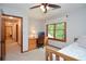 Bedroom featuring a built-in desk, neutral walls and trim and a view at 4366 Cedar Wood Sw Dr, Lilburn, GA 30047