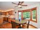 Breakfast nook with bay window, hardwood floors, and a ceiling fan at 4366 Cedar Wood Sw Dr, Lilburn, GA 30047