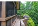 Deck featuring privacy screens, railing planters, a beautiful shade tree and lovely yard at 4366 Cedar Wood Sw Dr, Lilburn, GA 30047
