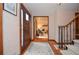 Welcoming entryway featuring hardwood floors, staircase, and view into the living room at 4366 Cedar Wood Sw Dr, Lilburn, GA 30047