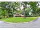 Corner lot home with a spacious front yard, mature trees, and classic brick facade at 4366 Cedar Wood Sw Dr, Lilburn, GA 30047