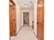 Hallway featuring neutral walls, carpet and wood doors at 4366 Cedar Wood Sw Dr, Lilburn, GA 30047
