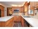 Well-lit kitchen with wood cabinetry, stainless steel appliances, and an island at 4366 Cedar Wood Sw Dr, Lilburn, GA 30047