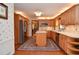 Well-equipped kitchen with wood cabinets, stainless steel appliances, and center island at 4366 Cedar Wood Sw Dr, Lilburn, GA 30047