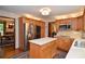 Traditional kitchen featuring wood cabinets, stainless steel appliances, and a center island at 4366 Cedar Wood Sw Dr, Lilburn, GA 30047
