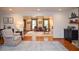 Open-concept living room with hardwood floors and ample natural light at 4366 Cedar Wood Sw Dr, Lilburn, GA 30047