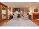 Spacious living room featuring hardwood floors, neutral colors, and access to screened porch at 4366 Cedar Wood Sw Dr, Lilburn, GA 30047
