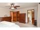 Spacious main bedroom featuring dark wood furniture and multiple entry points at 4366 Cedar Wood Sw Dr, Lilburn, GA 30047