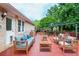 Staged back deck with patio furniture, wooden railings, and access to the home at 456 Harmony Grove Rd, Lilburn, GA 30047