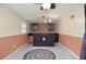 Basement with a vintage-style bar, cabinets, wainscoting, and ceiling fan at 456 Harmony Grove Rd, Lilburn, GA 30047