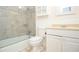 Bathroom features a glass enclosed shower, tile backsplash, and storage at 456 Harmony Grove Rd, Lilburn, GA 30047