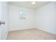 Bright empty bedroom featuring neutral carpet and abundant light at 456 Harmony Grove Rd, Lilburn, GA 30047